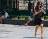 Girl falls into fountain while texting